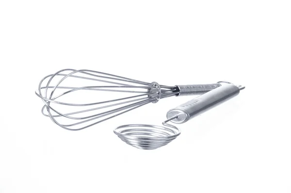 stock image Two kitchen tools: whisk and egg separator