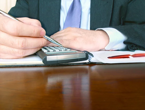 Businessman with calculator. — Stock Photo, Image