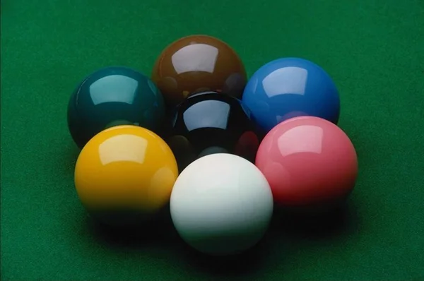 Color billiards balls on a green table — Stock Photo, Image