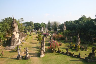 Buddha statues at the beautiful and bizarre buddha park in Vientiane, Laos. clipart