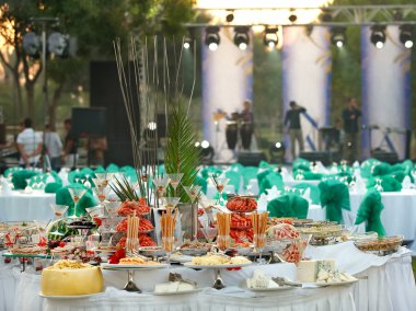 Covered table for a buffet table at the festival clipart