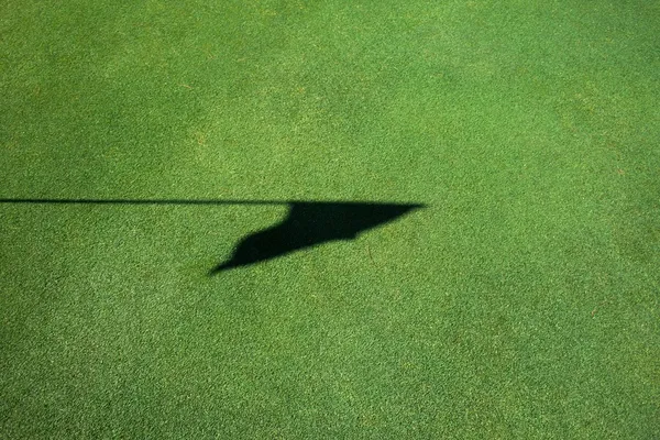 Golf flag shadow — Stock Photo, Image