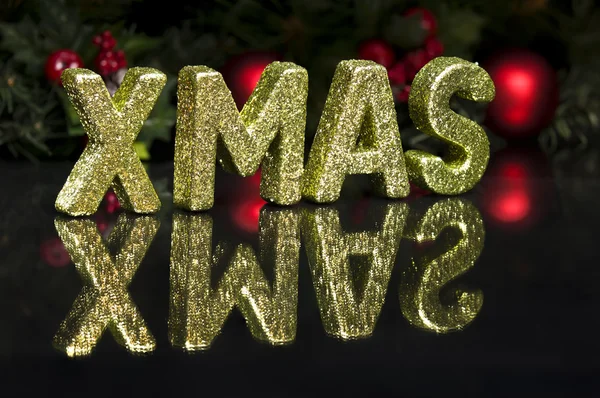 stock image In capital letter written Xmas, glitter effect