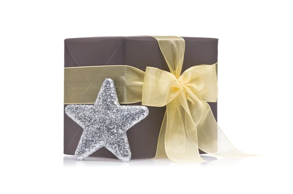 Present decorated with a glitter star — Stock Photo, Image