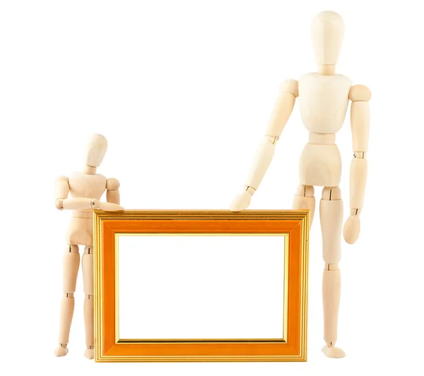 Two wooden dummy and empty frame — Stock Photo, Image
