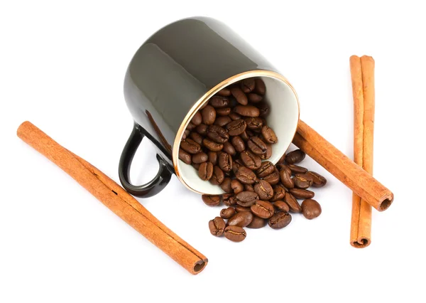 Cup with coffee beans and cinnamon sticks — Stock Photo, Image
