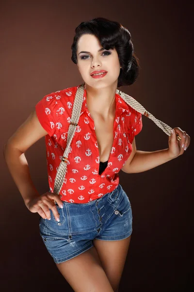 A photo of beautiful brunette is in style of pinup, glamur — Stock Photo, Image