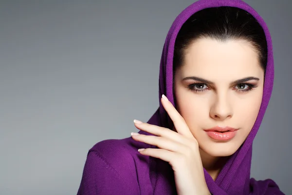 stock image A beautiful young woman is in red clothes