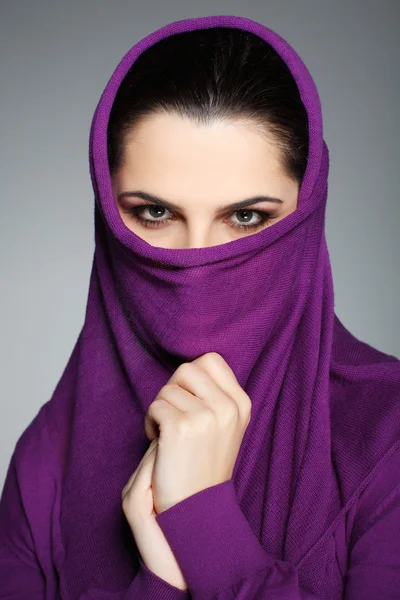 stock image A beautiful young woman is in red clothes