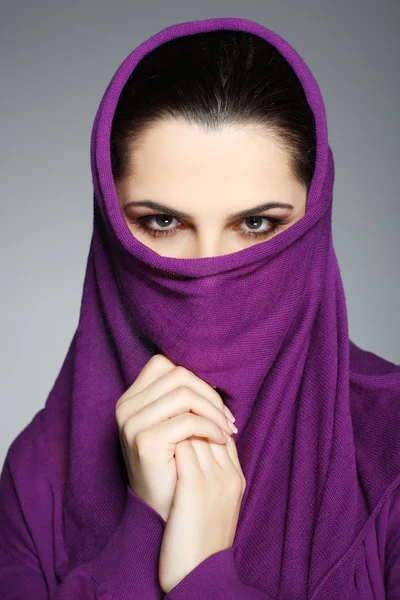 stock image A beautiful young woman is in red clothes