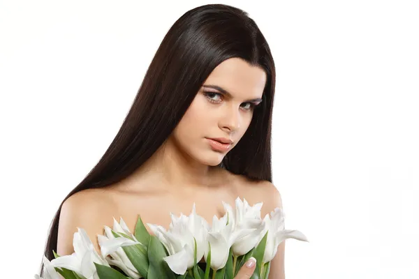 Vacker ung flicka med tulpaner — Stockfoto