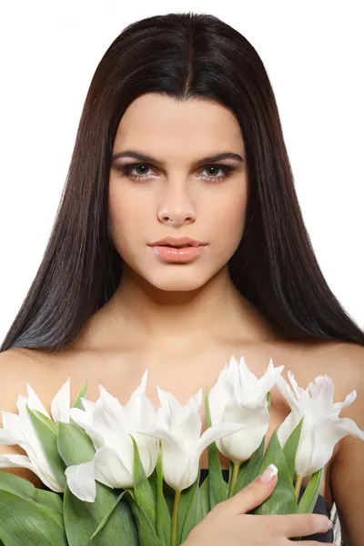 Beautiful young girl with tulips — Stock Photo, Image