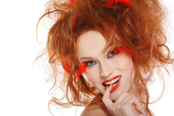 Beautiful redheaded girl with red feathers — Stock Photo, Image