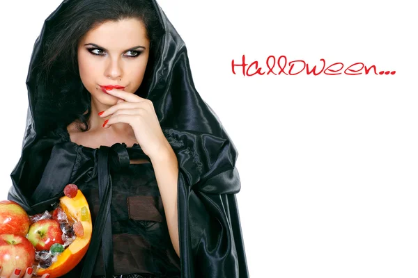 Morena sexual no terno de bruxa na noite de Halloween — Fotografia de Stock