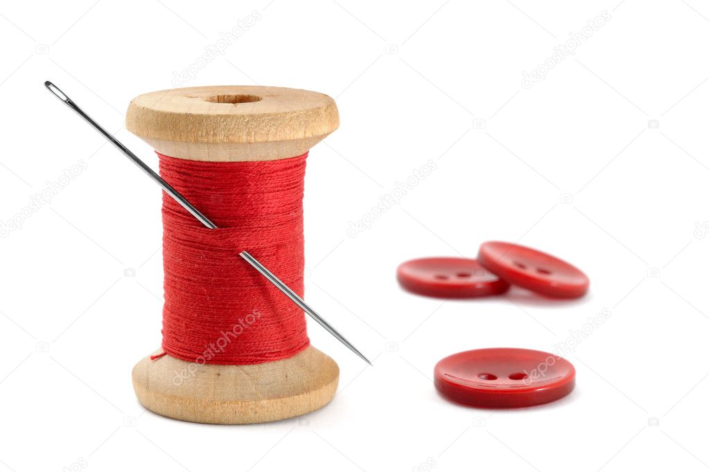 Spool of thread, needle and buttons isolated on white background ...