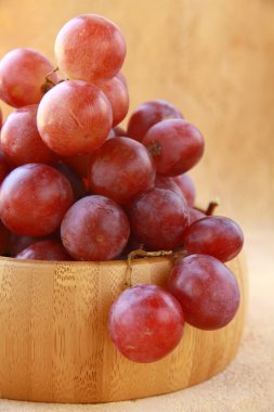 Large red ripe grapes and wine on the natural background clipart