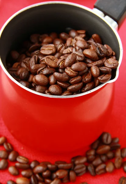 Fresh aromatic coffee beans in a metal coffee pot — Stock Photo, Image