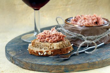 Pate of duck meat Rillettes de Canard with a glass of wine clipart