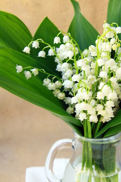 Lovely bunch of lily of the valley on a stone background — Stock Photo, Image