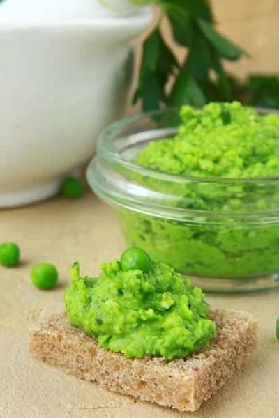 Pate with green peas on a piece of bread — Stock Photo, Image