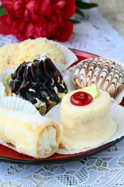Several kinds of cakes on a special stand dessert plates — Stock Photo, Image