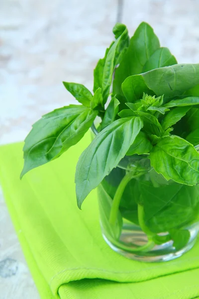Green fresh basil in a wooden bowl — Stock Photo, Image