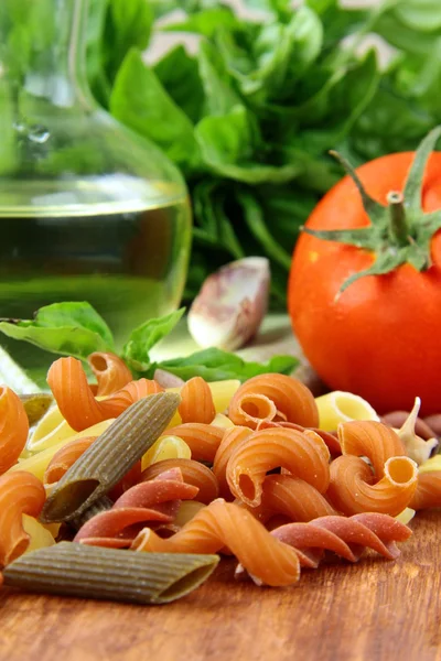 Basil, pasta and olive oil - still life in the Italian style — Stock Photo, Image