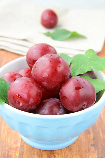 stock image Ripe, fresh red plums on the table