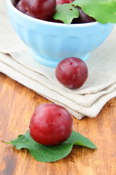 Stock image Ripe, fresh red plums on the table