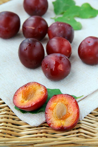 stock image Ripe, fresh red plums on the table