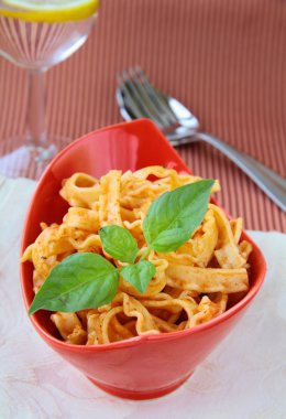 Italian pasta tripoline with tomato sauce and basil clipart