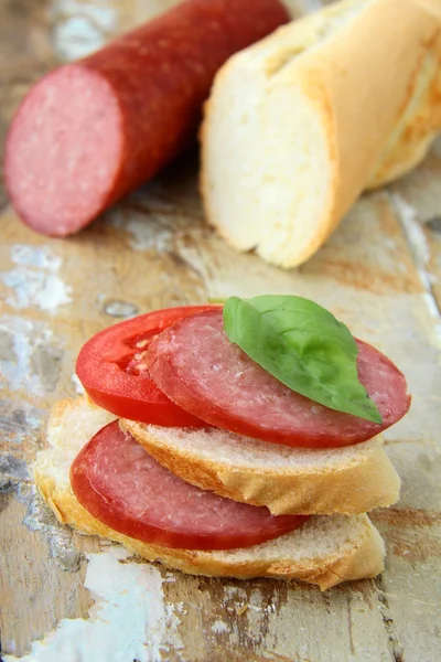 stock image Sandwiches with baguette and salami with cheese and tomatoes