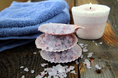 Spa still life .Bath lilac salt, towel and candle clipart