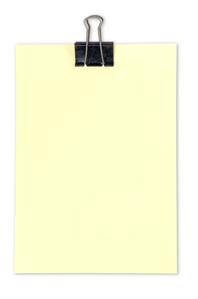 Black clip and yellow blank note — Stock Photo, Image