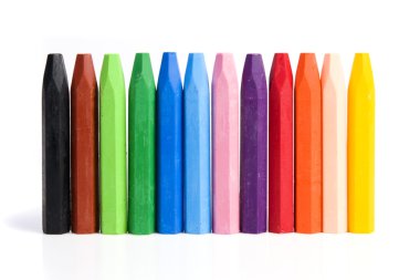 Colored wax crayons on isolated clipart