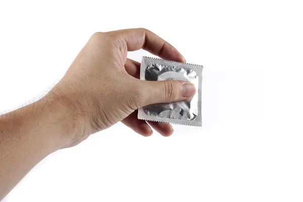 Condoom in de hand — Stockfoto