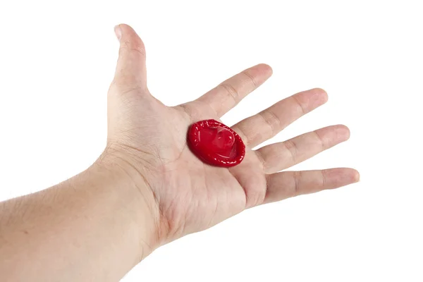 Condom in hand — Stock Photo, Image