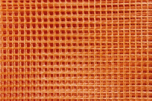 オレンジ色のプラスチック メッシュ — ストック写真