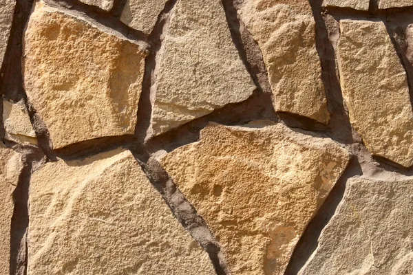 Fragment okrasné kamenné zdi — Stock fotografie