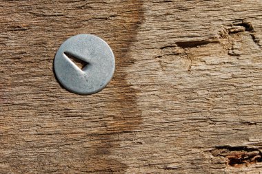 Metal pin in wooden board clipart