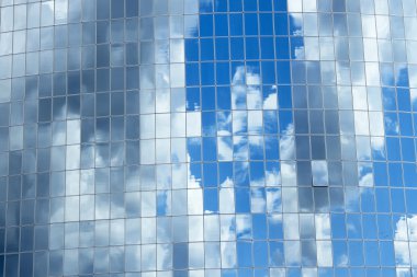 Sky reflected in skyscrapers windows clipart