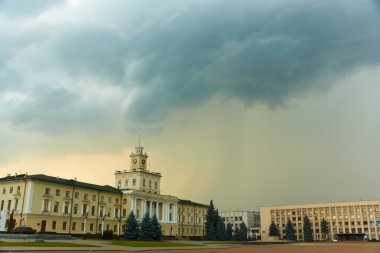 Storm clouds over buildings clipart