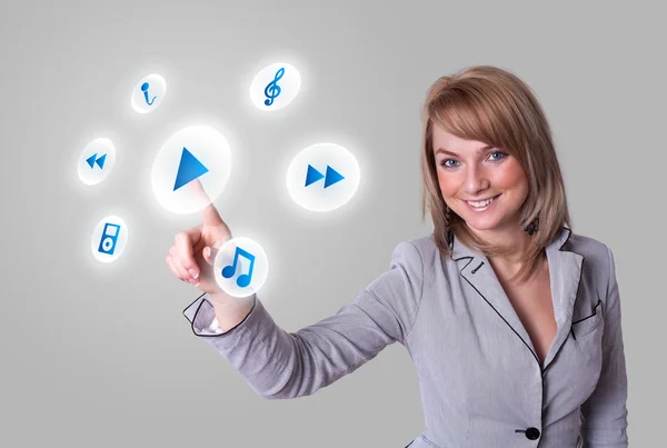 Woman pressing media player button — Stock Photo, Image