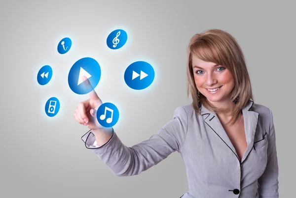 Woman pressing media player button — Stock Photo, Image