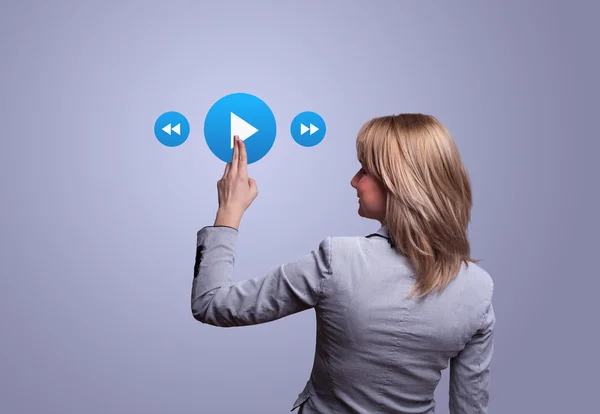 Hand pressing media player button — Stock Photo, Image