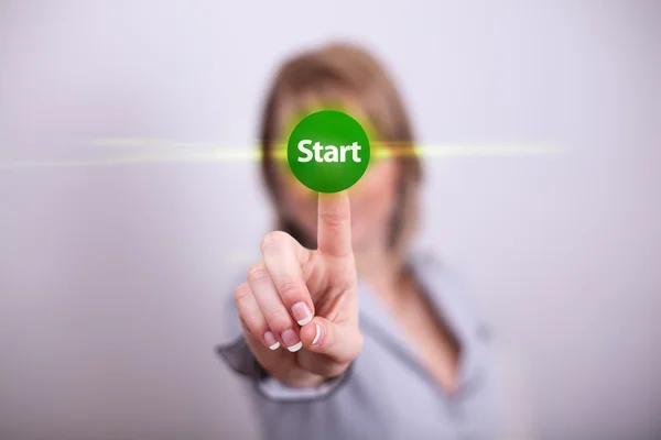 Woman pressing start button — Stock Photo, Image