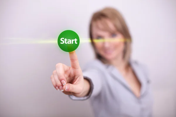 Woman pressing start button — Stock Photo, Image