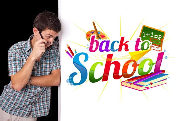 Student looking at back to school sign — Stock Photo, Image
