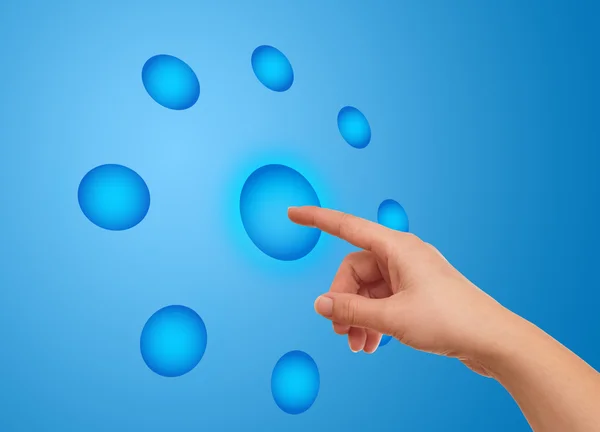 stock image The hand on the flow of several button
