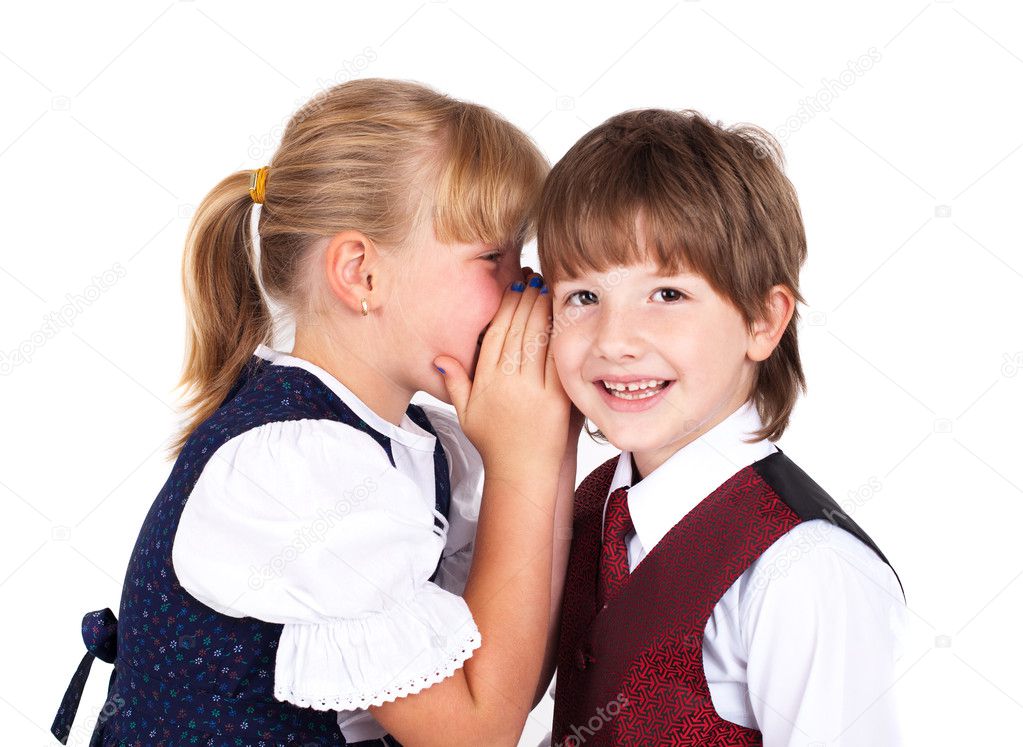 Two little kids telling secrets